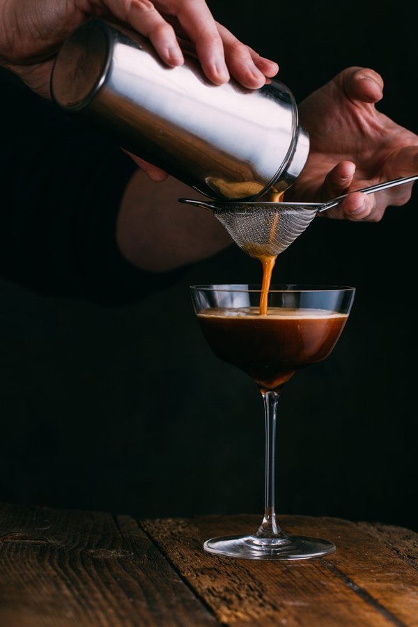 How do you develop a signature cocktail menu that reflects your bar's identity?